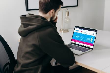 Man looking at steps2change website on a laptop