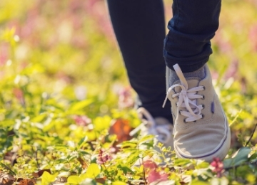 Feet walking on the grass